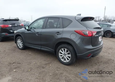2014 Mazda Cx-5 Touring z USA, uszkodzony, nr VIN JM3KE2CYXE0339273